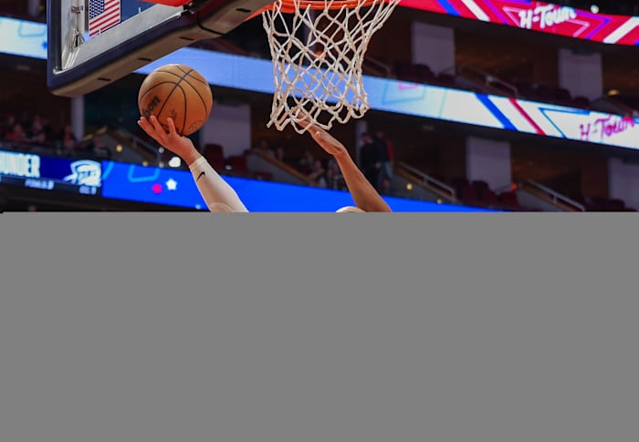 Dec 6, 2023; Houston, Texas, USA; Houston Rockets forward Dillon Brooks (9) makes a basket against Oklahoma City Thunder guard Aaron Wiggins (21) in the second quarter at Toyota Center.